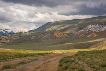 road steppe mountains clouds sky summer