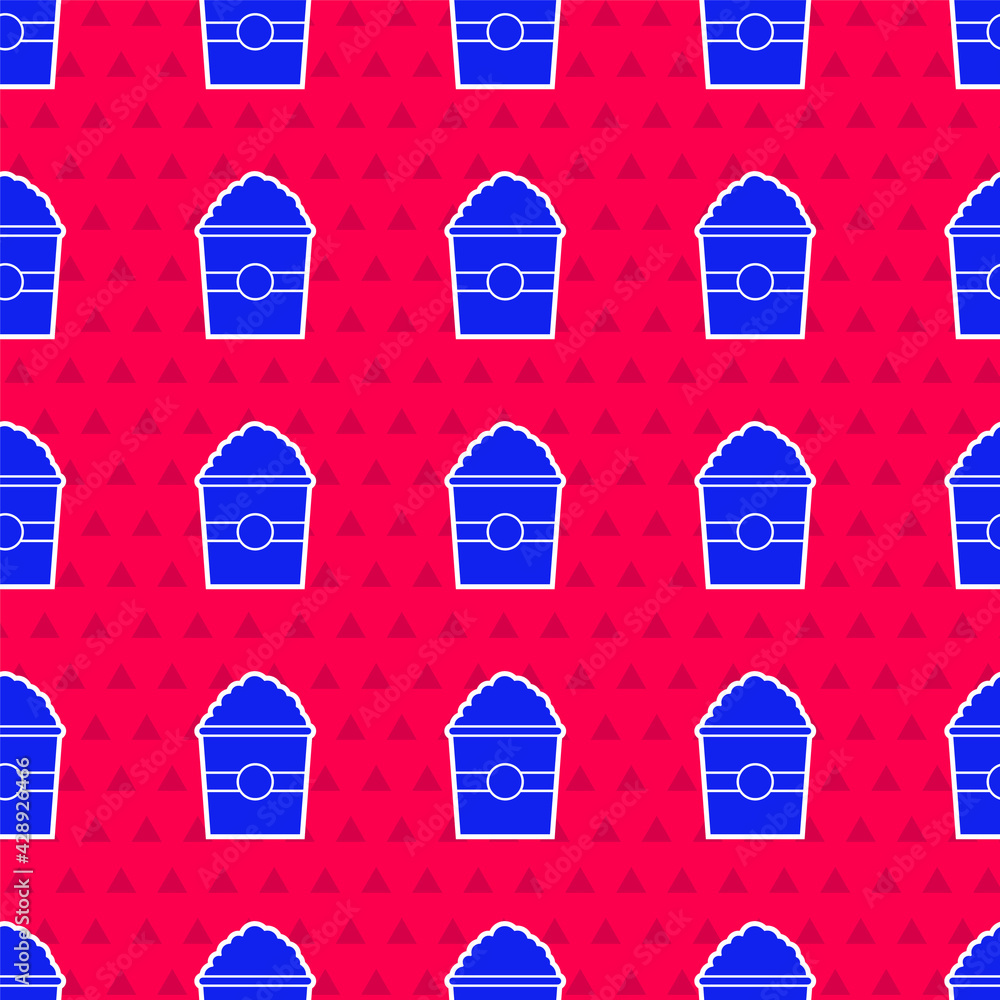 Poster blue popcorn in cardboard box icon isolated seamless pattern on red background. popcorn bucket box. 