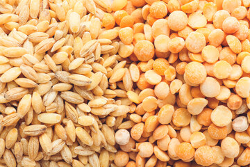 Heap of split peas and pearled barley as background