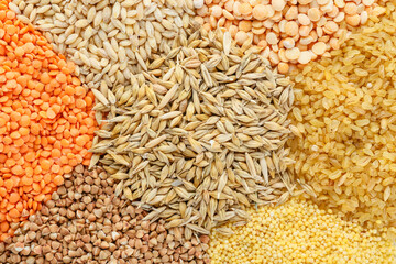 Heap of different cereals and legumes as background