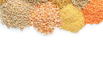 Heap of different cereals and legumes on white background