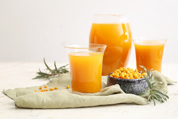 Healthy sea buckthorn juice on white background