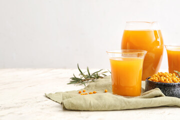 Healthy sea buckthorn juice on white background