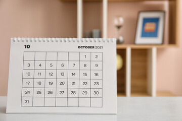 Flip paper calendar on table in office