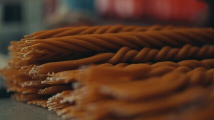 Pile Of Yellow Twisted Handcrafted Candles Made By Mayan Locals In Antigua Guatemala, Central America. - Rack Focus Shot 