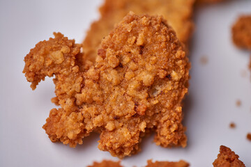 macro closeup of kid's meal dinossaur chicken nuggets snacks