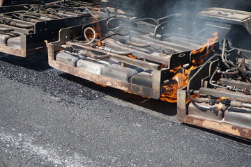 Road maintenance work With heavy machinery by HOT MIX IN - PLACE RECYCLING method