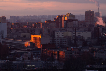 Fototapeta premium Sunset light in big city on buildings