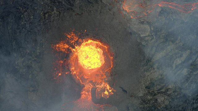 Drone vertically over active, hot and continuous volcanic eruption. Aerial top down view.