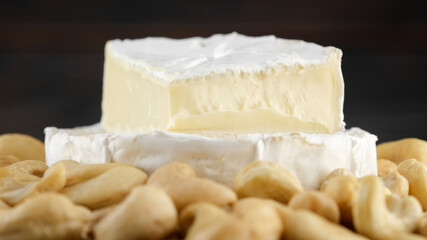 Fototapeta na wymiar soft cheese camembert or brie with cashews