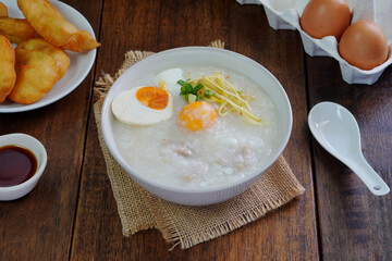 Boiled rice or porridge with pork for breakfast, cooked eggs, Pa