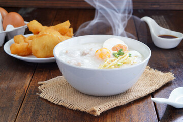 Boiled rice or porridge with pork for breakfast, cooked eggs, Pa