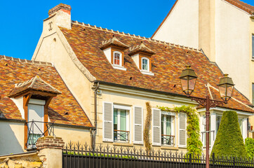 Nice mediterranean house facades roofs and windows with different colours