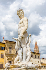 Fototapeta na wymiar Famous Fountain of Neptune on Piazza della Signoria in Florence, Italy