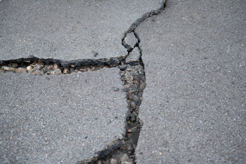 asphalt road in need of repair