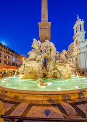 Fototapeta na wymiar Illuminated at night the Fiumi Fountain on Piazza Navona, Rome, Italy.