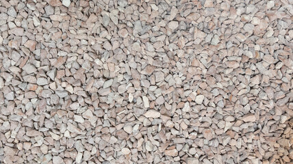 Seamless little gravel laid on outdoor ground floor background small stones texture