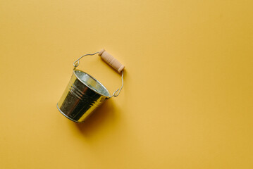 a small cauldron on a yellow background