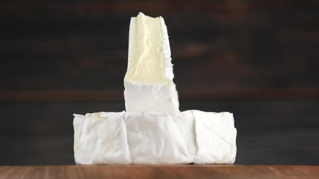 camembert or brie cheese rotation. Soft, creamy cheese. 4K UHD video
