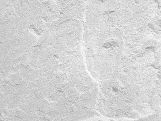 Obraz premium Rough white stone wall background in vintage style for graphic design or wallpaper