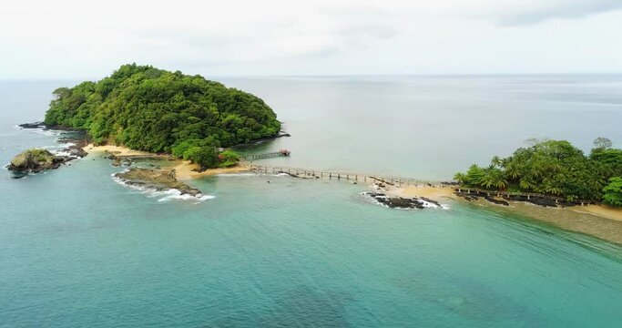 Aerial drone view of a small bridge between Ilheu Bombom and the Bom Bom beach, in Principe