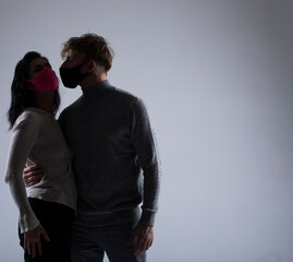 portrait of a couple. Mask couple. Hope. Virus. Shadow.