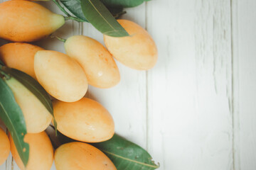 Fresh ripe organic sweet yellow Mayongchid. Tropical exotic summer.