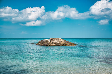 Empty, calm sandy crescent Kalim Bay, Beach with turquoise blue clear water and cirrus cloudy sky