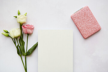 Modern summer stationery still life. Pink mirror and pink eustona flowers. Blank greeting card mock up scene. 