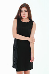 A pretty young businesswoman dress up in black smart casual skirt look elegantly against white...
