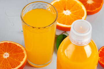 Orange juice cup on table close up