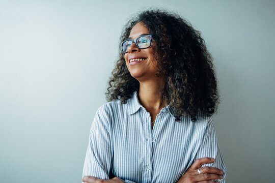 Mature businesswoman looking away and smiling