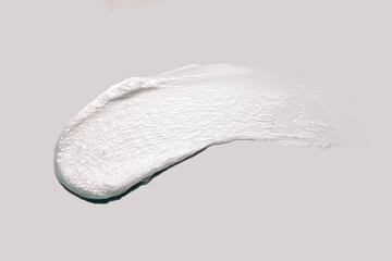 Cosmetic cleansing foam smudge on gray background