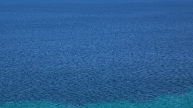 Aerial view 4k stock video footage of beutiful blue sea water texture. Abstract natural background