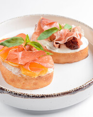 Juicy tomatoes and fresh fruit with carpaccio meat on fresh bread, sauce as topping. Traditional...