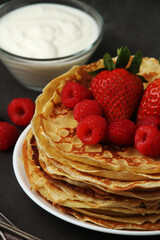 Russian cuisine national dish bliny with fresh berries