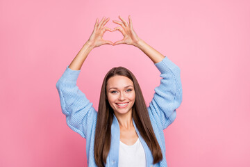 Photo of attractive charming cute woman make fingers heart figure isolated on pastel pink color background