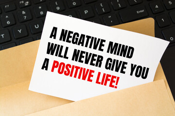 The text A negative mind will never give you a positive life. Motivational quote.