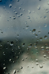 Background. Water drops on the glass, window. Blue sky