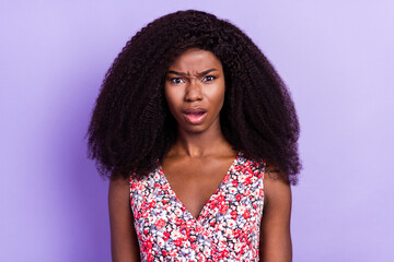 Photo of young attractive afro girl unhappy sad upset negative fake news isolated over purple color...
