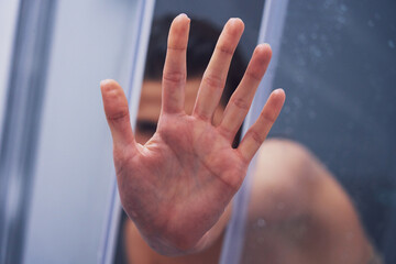Adult woman under the shower in bathroom