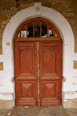 vintage front door with old, warped paint