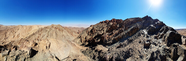 hiking trail in Eilat mountains. Red rock formations and boulders. Panoramic view over the trail on surrounding red mountains. Eilat, Israel Israel, Eilat Mountains: Red Canyon