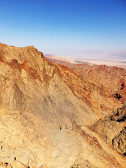 hiking trail in Eilat mountains. Red rock formations and boulders. Panoramic view over the trail on surrounding red mountains. Eilat, Israel Israel, Eilat Mountains: Red Canyon