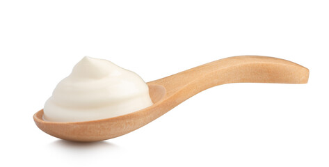 mayonnaise in a special wooden spoon for sauces isolated on white