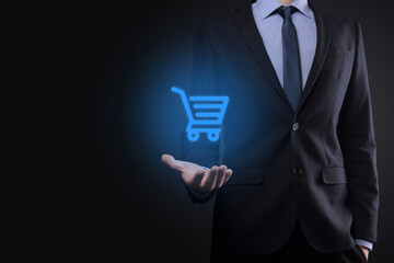 Businessman man holding shopping cart trolley mini cart in business digital payment interface.Business, commerce and shopping concept