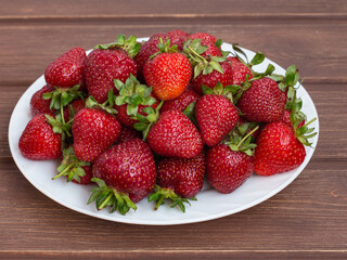 farm red ripe strawberries in a plate