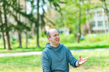 Man showing gestures with his hands and explaining something 