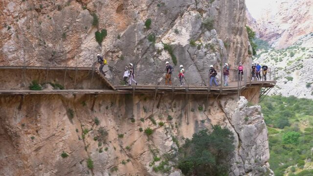 Malaga, Spain. Circa April 2021.People in Royal Trail (El Caminito del Rey) in Gorge of the Gaitanes Chorro, Malaga province.