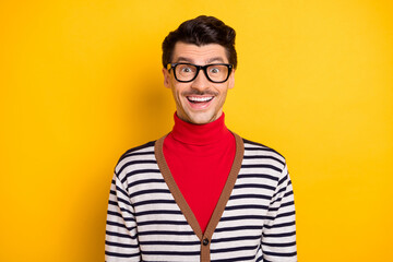 Photo of young handsome man happy positive smile amazed shocked surprised news sale isolated over yellow color background